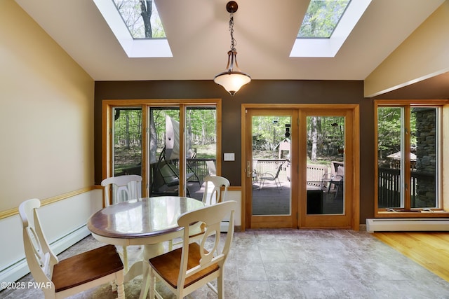 2766 Owego Tpke, Hawley, PA 18428 - dining space featuring a skylight, lofted ceiling, a baseboard heating unit, and french doors