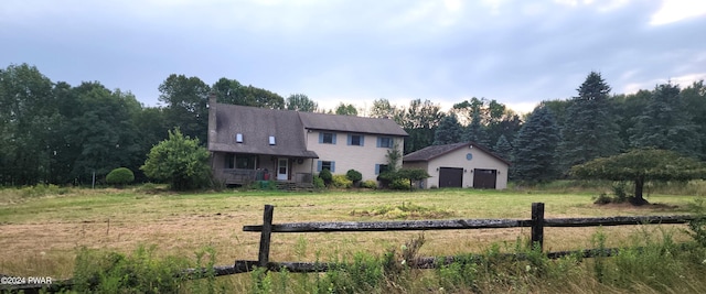 view of front of property featuring an outbuilding and a garage