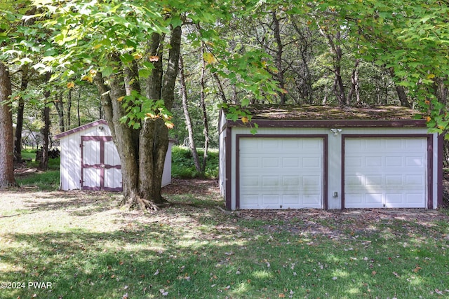 garage with a yard