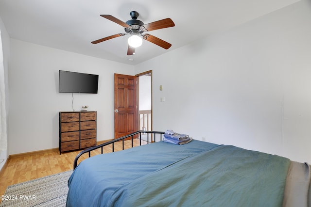 bedroom featuring hardwood / wood-style floors and ceiling fan