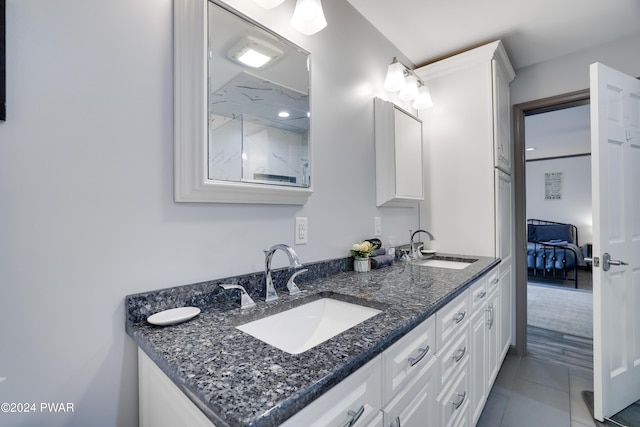 bathroom featuring tile patterned floors and vanity