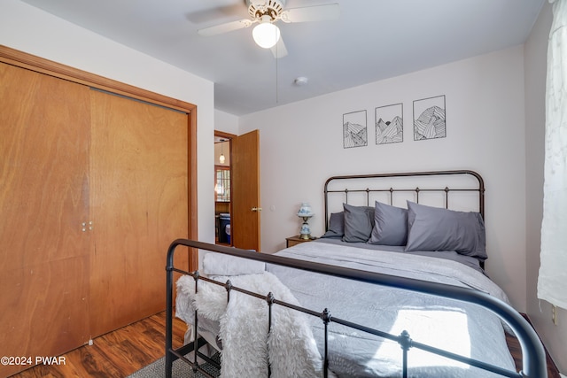 bedroom featuring hardwood / wood-style floors, ceiling fan, and a closet