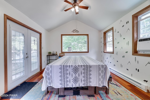 dining space with ceiling fan, french doors, a baseboard radiator, and hardwood / wood-style flooring