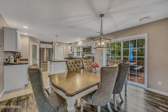 1011 Salem Pl, Lake Ariel, PA 18436 - dining space with wood finished floors, baseboards, a chandelier, and recessed lighting