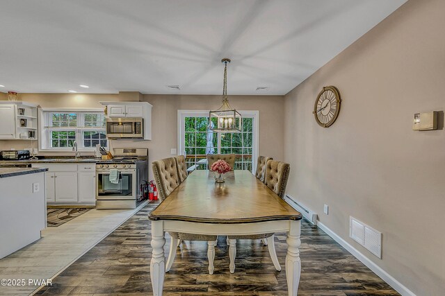 1011 Salem Pl, Lake Ariel, PA 18436 - dining room featuring a baseboard radiator, wood finished floors, healthy amount of natural light, a chandelier, and recessed lighting