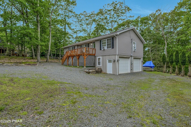 1011 Salem Pl, Lake Ariel, PA 18436 - view of front of property featuring stairway, a wooden deck, and an attached garage