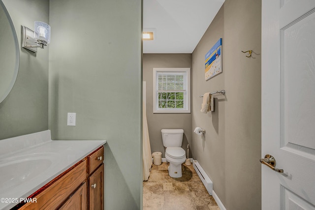 1011 Salem Pl, Lake Ariel, PA 18436 - full bathroom featuring a baseboard heating unit, vanity, toilet, baseboards, and stone finish floors