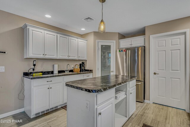 1011 Salem Pl, Lake Ariel, PA 18436 - kitchen with freestanding refrigerator, a sink, white cabinetry, light wood-type flooring, and recessed lighting