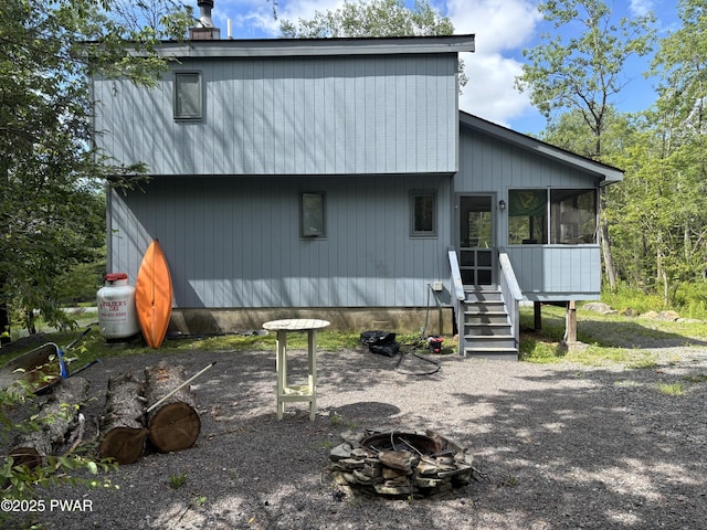 1267 Brookfield Rd, Lake Ariel, PA 18436 - rear view of property with a fire pit and a sunroom