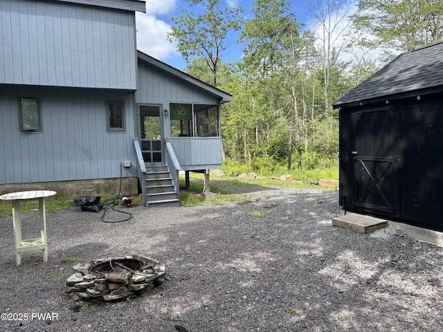 1267 Brookfield Rd, Lake Ariel, PA 18436 - view of side of home featuring a fire pit and a sunroom