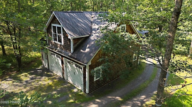 401 Log Tavern Rd, Milford, PA 18337 - view of side of home with roof with shingles and an attached garage