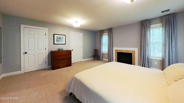 401 Log Tavern Rd, Milford, PA 18337 - bedroom featuring light carpet and a fireplace