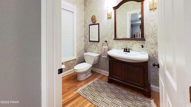 401 Log Tavern Rd, Milford, PA 18337 - half bathroom with wood finished floors, vanity, and wallpapered walls