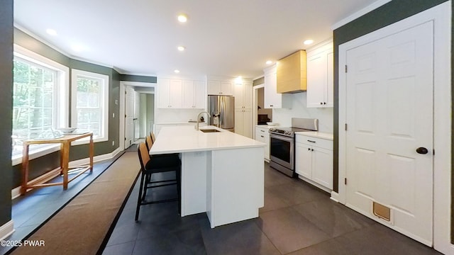 401 Log Tavern Rd, Milford, PA 18337 - kitchen with stainless steel appliances, white cabinets, light countertops, ornamental molding, and an island with sink