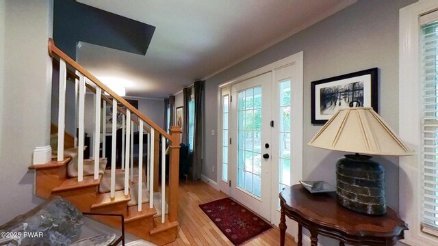 401 Log Tavern Rd, Milford, PA 18337 - entrance foyer with wood finished floors, stairway, and ornamental molding