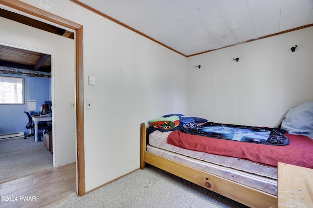 bedroom featuring crown molding and light colored carpet