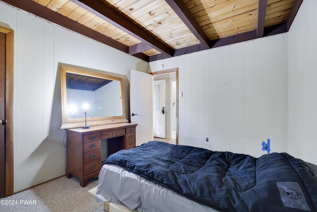 bedroom featuring beamed ceiling, light colored carpet, wooden ceiling, and wood walls