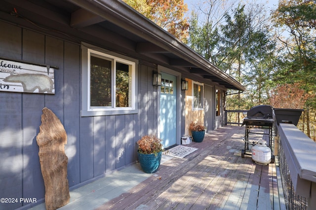 wooden terrace featuring grilling area