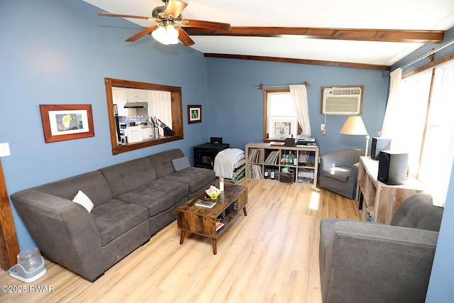 108 Boyds Mills Rd, Beach Lake, PA 18405 - living area with wood finished floors, a wall unit AC, beamed ceiling, and a ceiling fan