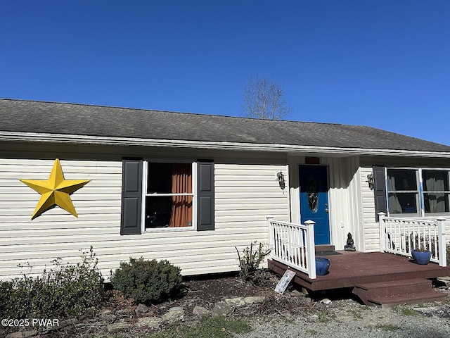 108 Boyds Mills Rd, Beach Lake, PA 18405 - view of exterior entry with a shingled roof and a wooden deck