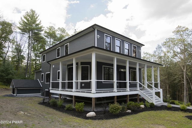 back of house with covered porch and central air condition unit