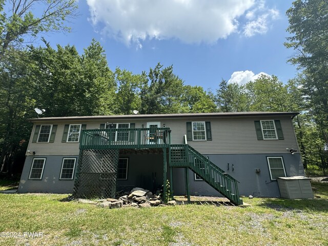 1412 Woodview Ter # 56, Lake Ariel, PA 18436 - rear view of house featuring stairway, a wooden deck, a yard, and central AC unit