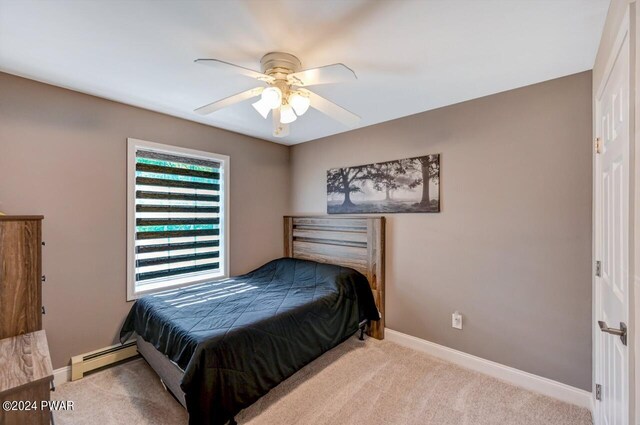 1412 Woodview Ter # 56, Lake Ariel, PA 18436 - bedroom with carpet floors, a baseboard heating unit, baseboards, and a ceiling fan