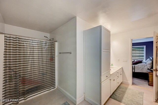 1412 Woodview Ter # 56, Lake Ariel, PA 18436 - full bath featuring vanity, a shower with curtain, tile patterned floors, connected bathroom, and baseboards
