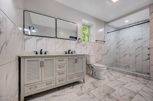 1412 Woodview Ter # 56, Lake Ariel, PA 18436 - bathroom featuring tile walls, double vanity, a marble finish shower, toilet, and marble finish flooring