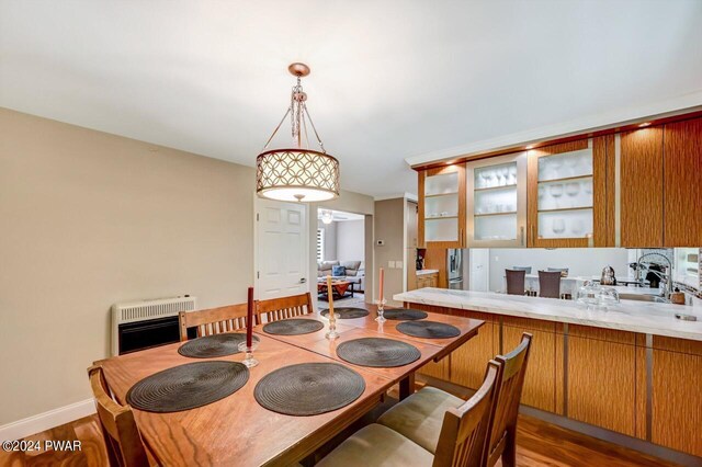 1412 Woodview Ter # 56, Lake Ariel, PA 18436 - dining room featuring heating unit, wood finished floors, and baseboards