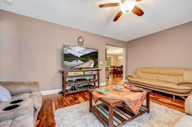 1412 Woodview Ter # 56, Lake Ariel, PA 18436 - living area with ceiling fan, baseboards, and wood finished floors