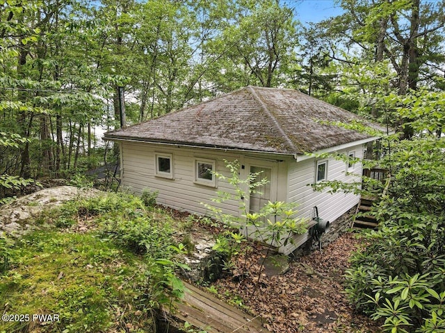 193 Old Rte 402, Dingmans Ferry, PA 18328 - view of property exterior with an outbuilding and roof with shingles