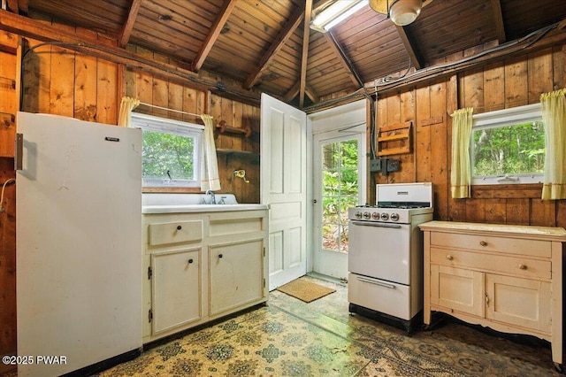 193 Old Rte 402, Dingmans Ferry, PA 18328 - kitchen with white appliances, wood walls, wood ceiling, and light countertops
