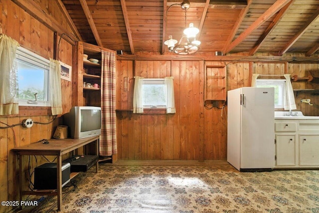 193 Old Rte 402, Dingmans Ferry, PA 18328 - kitchen with wooden ceiling, freestanding refrigerator, wooden walls, and a chandelier