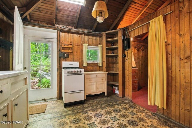 193 Old Rte 402, Dingmans Ferry, PA 18328 - kitchen with white gas range, healthy amount of natural light, wooden ceiling, wooden walls, and open shelves