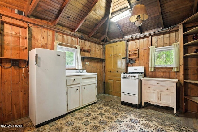 193 Old Rte 402, Dingmans Ferry, PA 18328 - kitchen featuring white appliances, wooden walls, light countertops, lofted ceiling, and open shelves