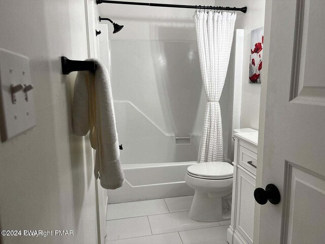 full bathroom with tile patterned flooring, shower / tub combo, vanity, and toilet