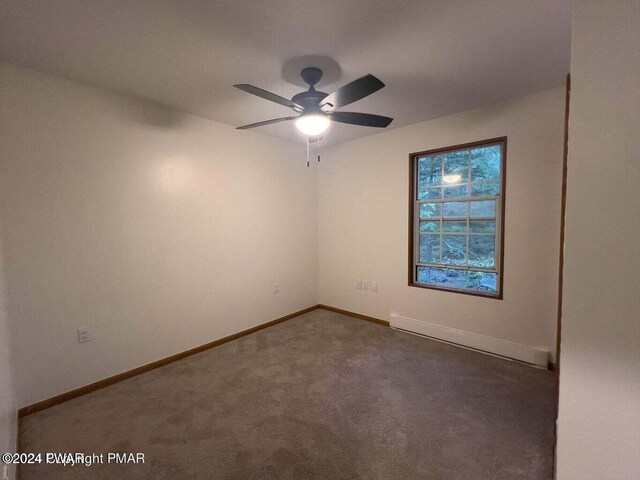 carpeted empty room featuring ceiling fan