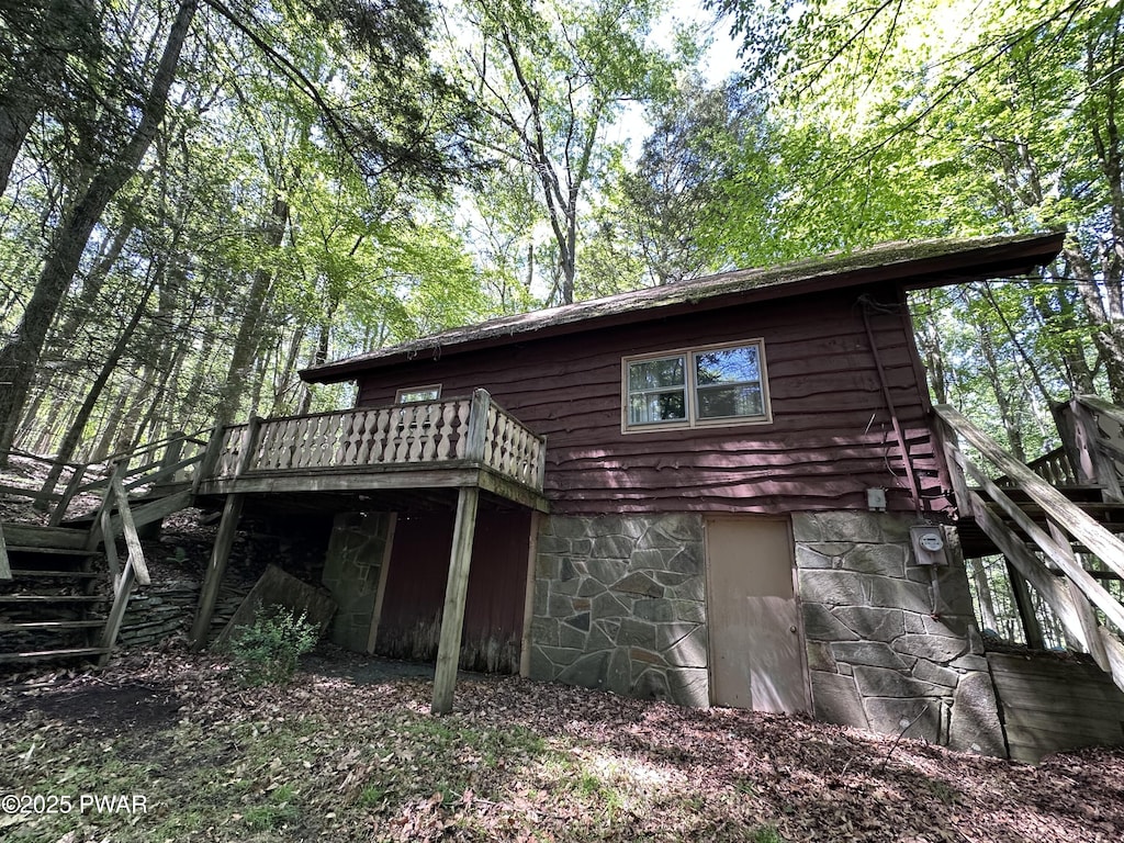 77 Deerfoot Rd, Lake Ariel, PA 18436 - back of property with stairway and a deck