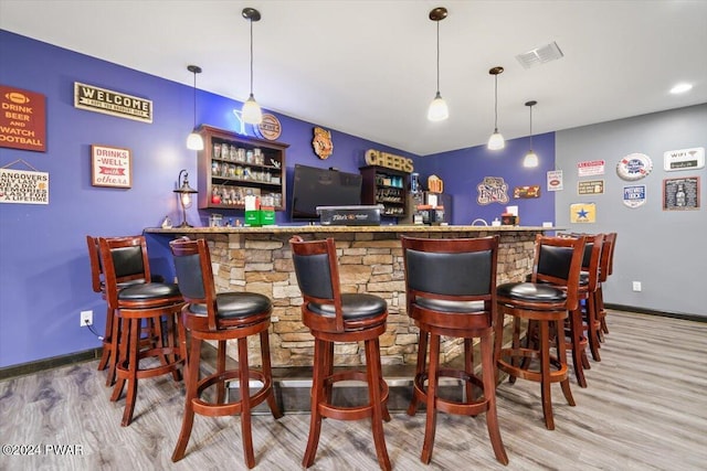 49 White Pine Cir, Lake Ariel, PA 18436 - indoor dry bar with wood finished floors, baseboards, and pendant lighting