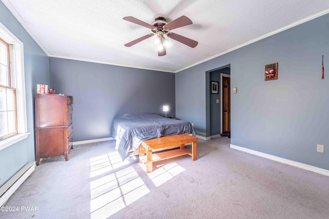 carpeted bedroom featuring baseboard heating, ceiling fan, a textured ceiling, and ornamental molding