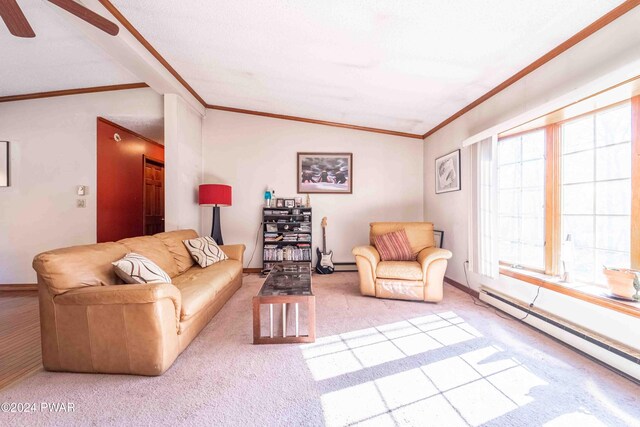 carpeted living room featuring vaulted ceiling, baseboard heating, crown molding, and ceiling fan