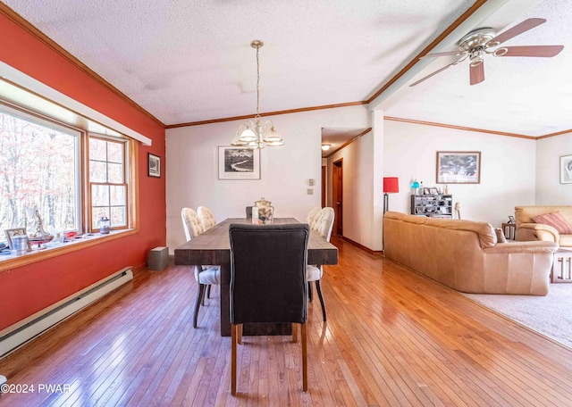 dining room featuring ceiling fan with notable chandelier, a textured ceiling, vaulted ceiling, a baseboard heating unit, and wood-type flooring