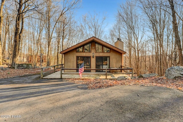 139 Ridgeview Dr, Lake Ariel, PA 18436 - view of front of house with a chimney and covered porch