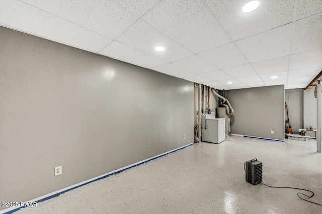 finished below grade area featuring recessed lighting, a drop ceiling, and baseboards