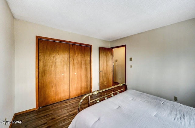 bedroom with a closet and wood finished floors