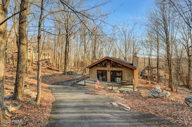 139 Ridgeview Dr, Lake Ariel, PA 18436 - view of front of house featuring a chimney and driveway