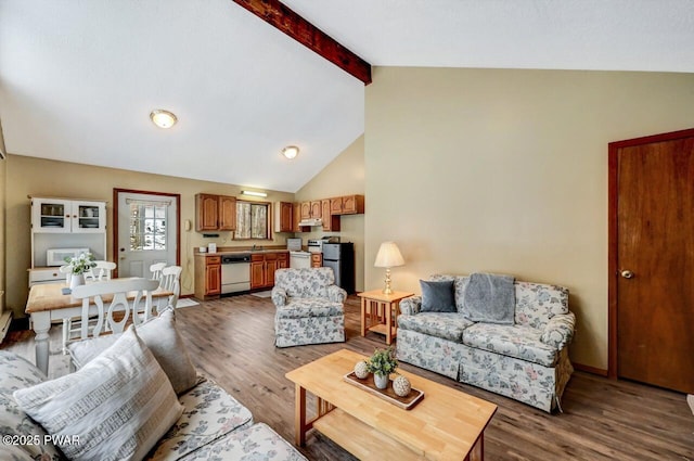 living room with lofted ceiling with beams, baseboards, and wood finished floors