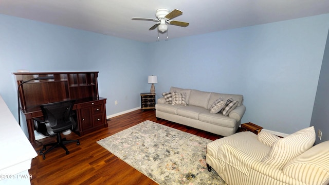 living area with ceiling fan, baseboards, and dark wood-style floors