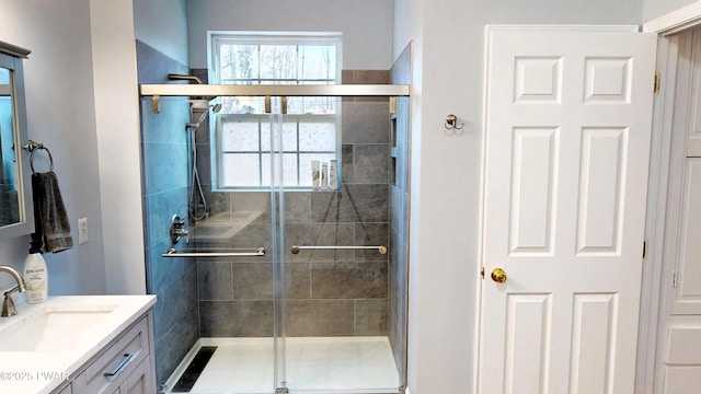 bathroom with vanity and a stall shower